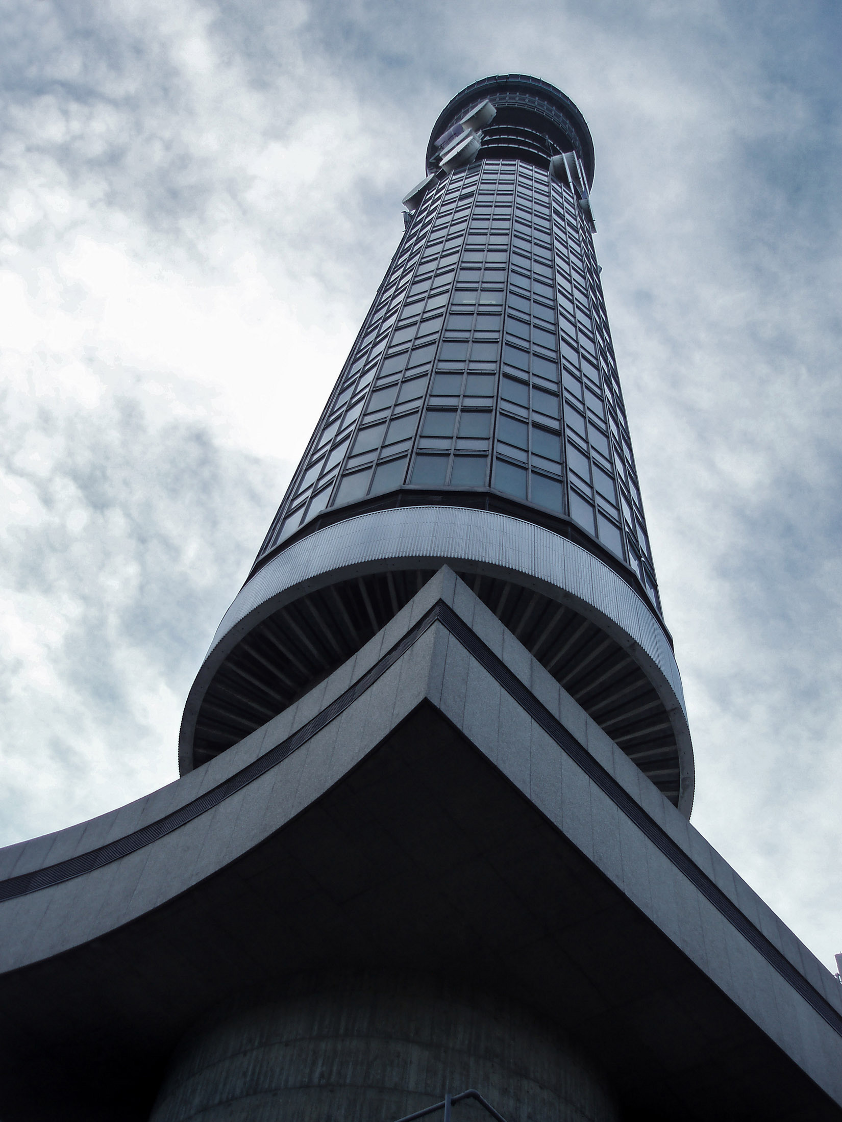 an image of Famous Architecture: BT Tower in Fitzrovia, London. It has been previously known as the Post Office Tower, the London Telecom Tower and the British Telecom Tower.
