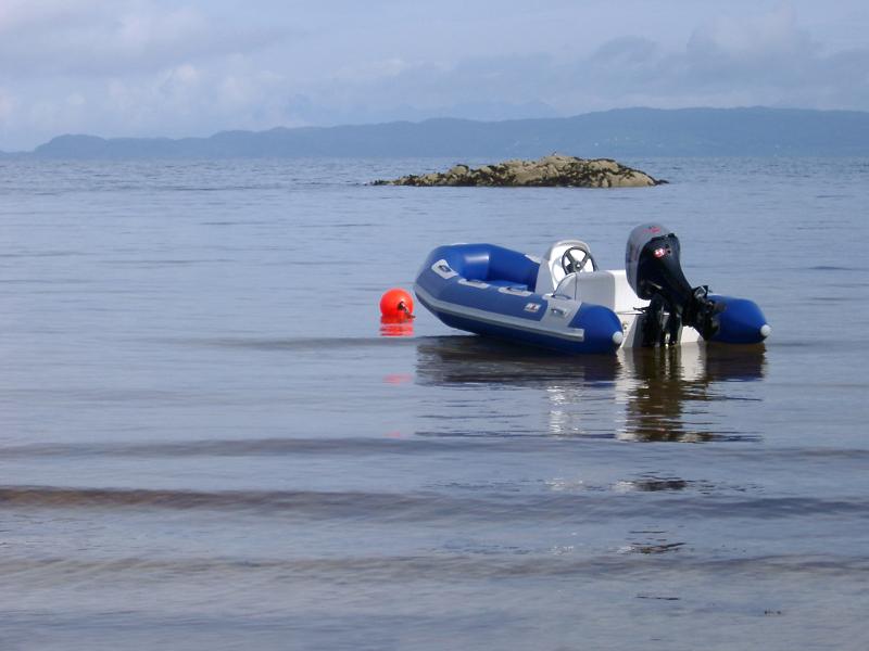 Small Blue Motorboat for Leisure Activity Resting on the Beautiful Sea at Scotland