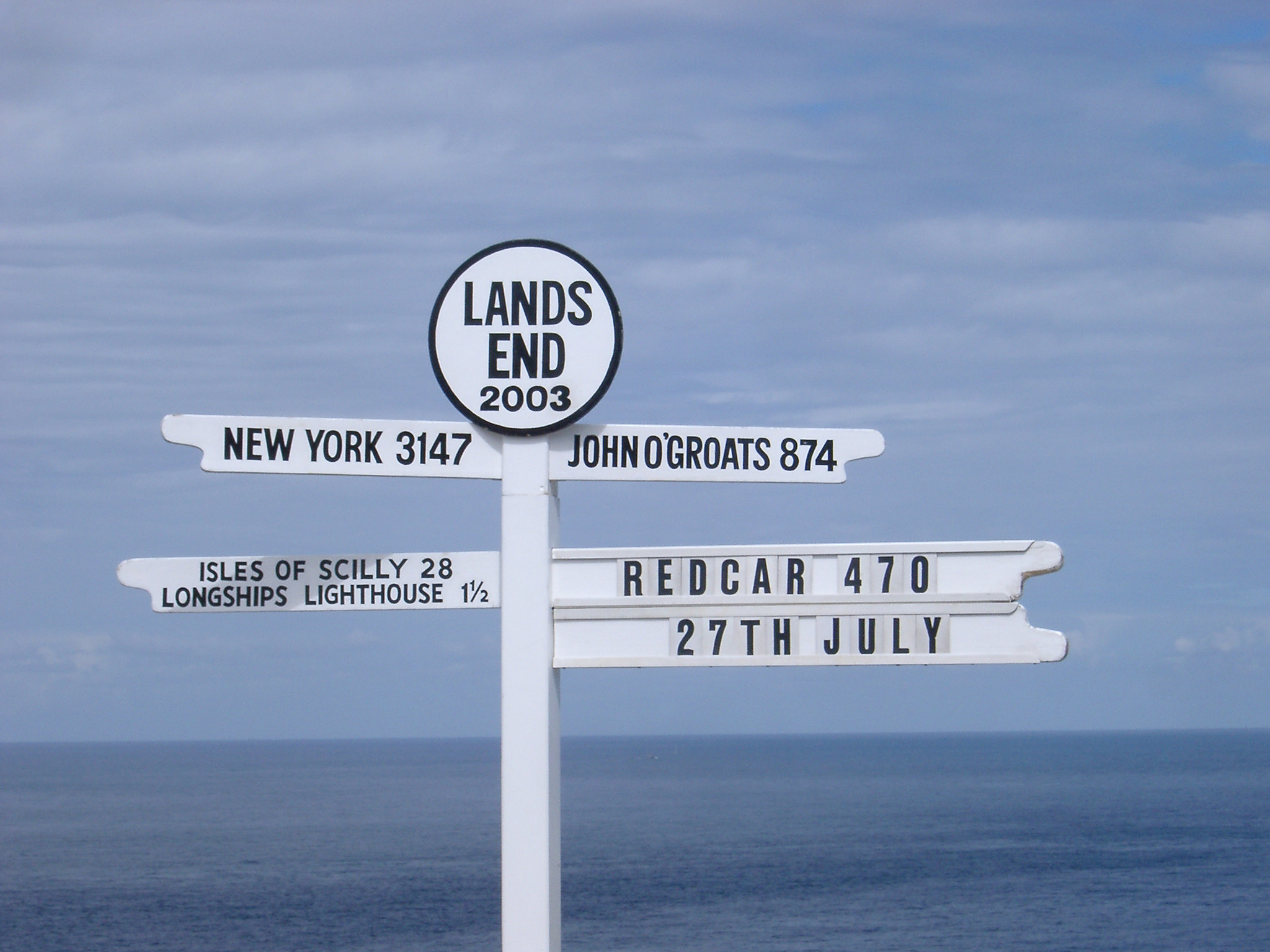 an image of Signpost at Lands End, the most westerly point on mainland UK and a popular tourist attraction