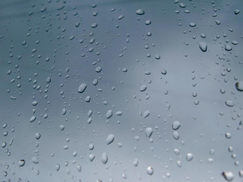 Conceptual Rain Drops on Glass Window Close up Shot of Conceptual Rain Drops on Glass Window. Can be Used for Wallpaper Backgrounds.