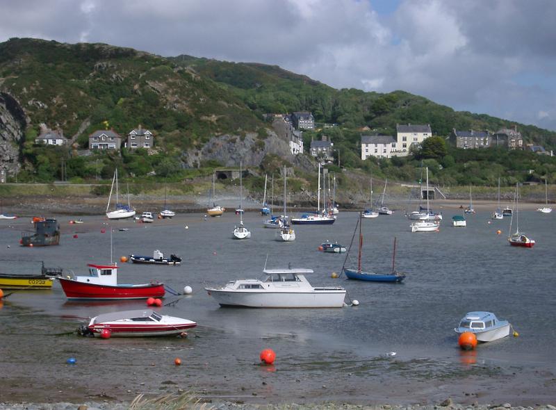 Sailboats and Fishing Boats Anchored in Harbor at Low Tide, Barmouth, Gwynedd, Wales