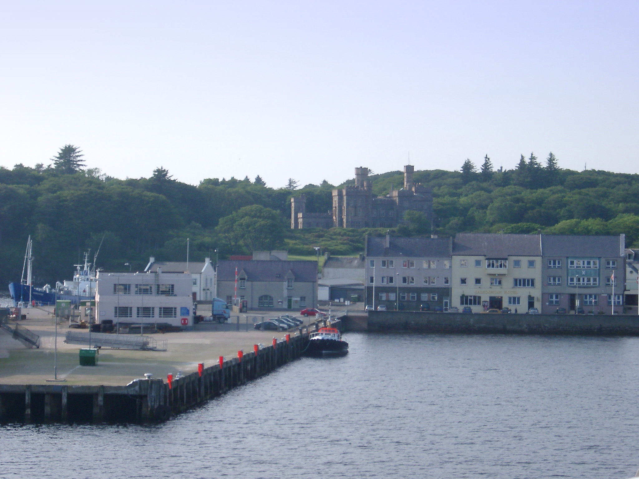 an image of Coastal Village of Stornoway with Historical Lews Castle in Background, Isle of Lewis, Scotland