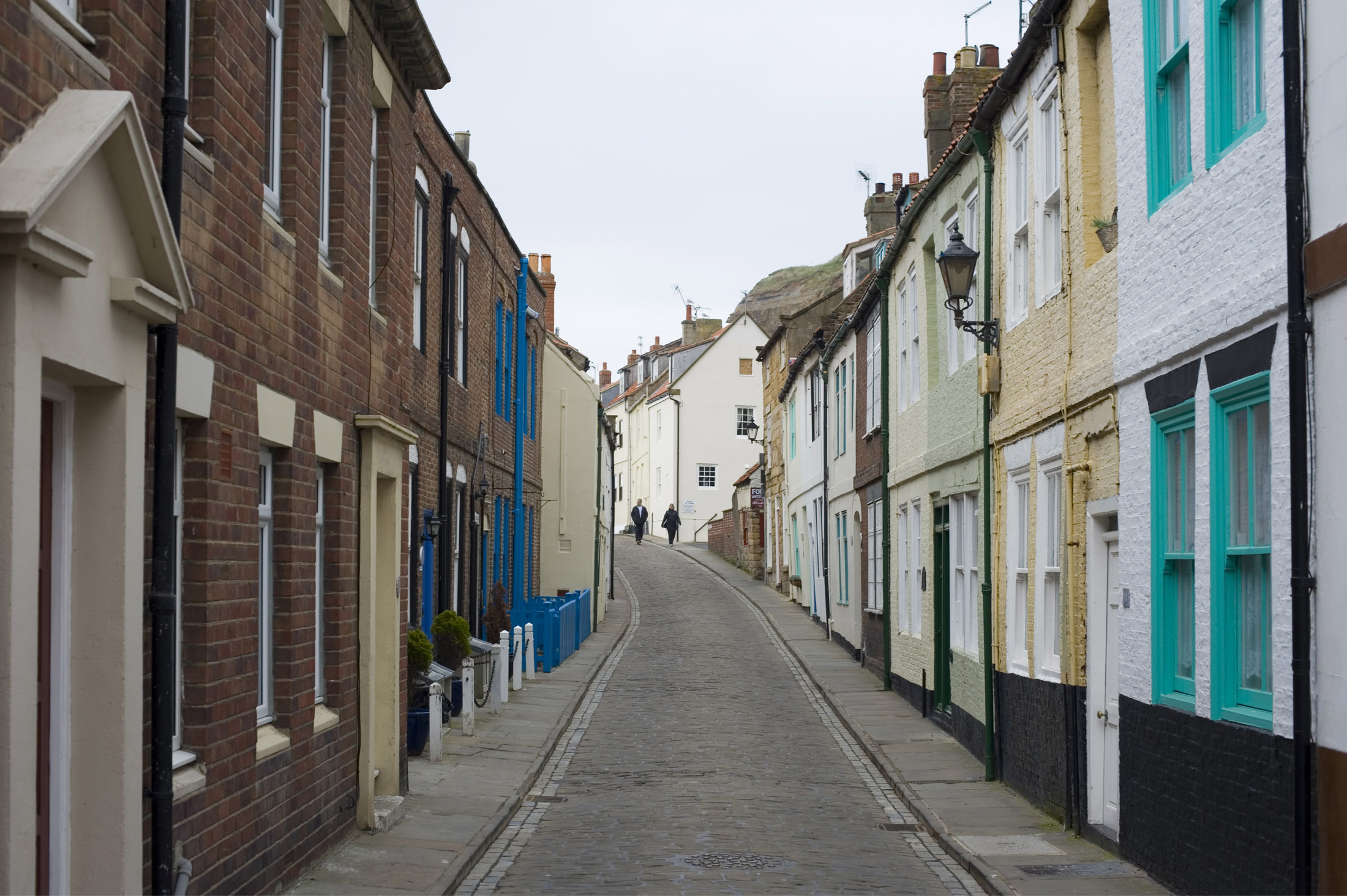 an image of henrietta street lined with old fishing cottags on whitbys east cliff