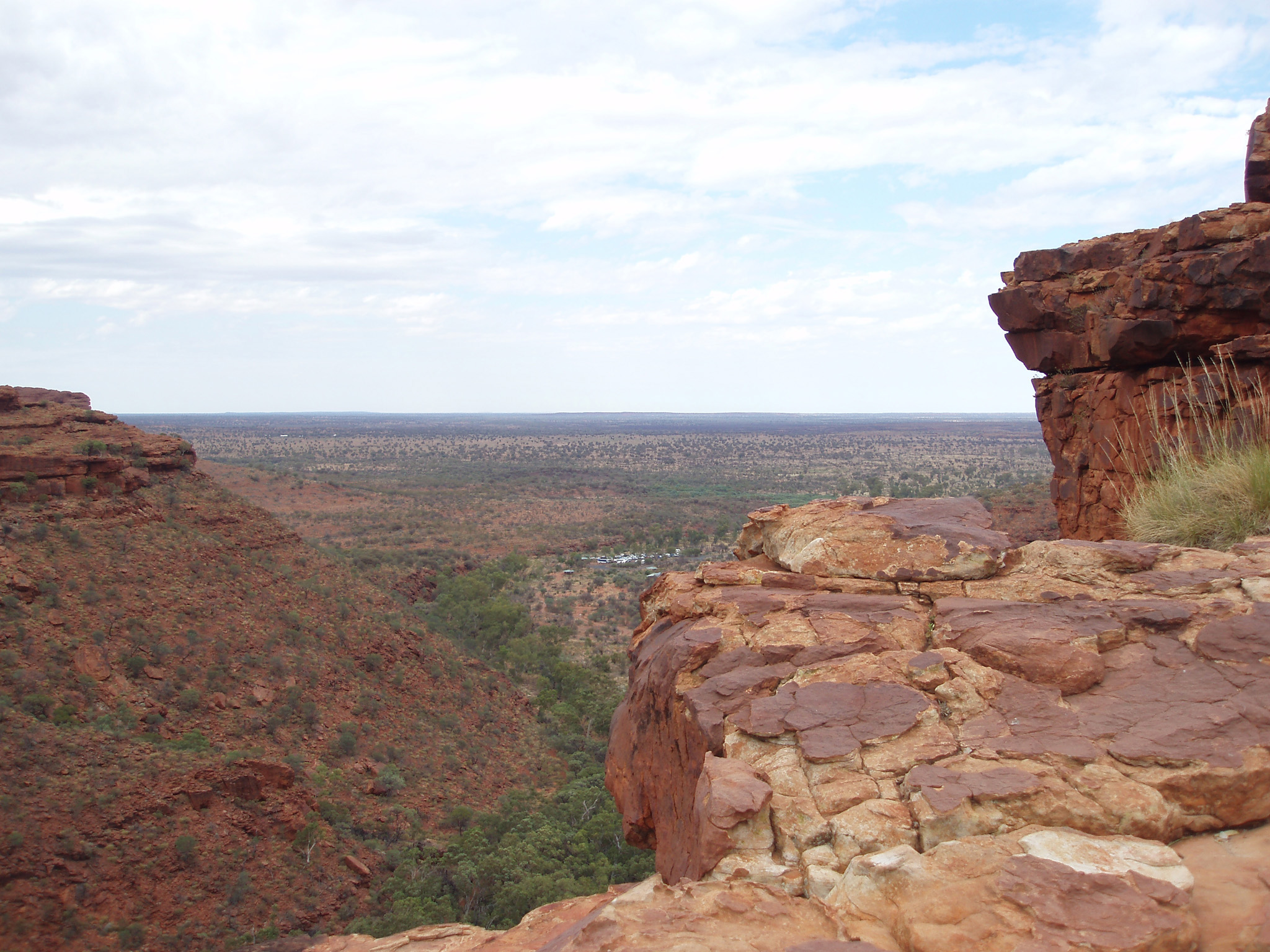 an image of Beautiful Extensive View of Kings Canyon Landscape at Northern Territory, Australia on Very Light Blue Sky Above.
