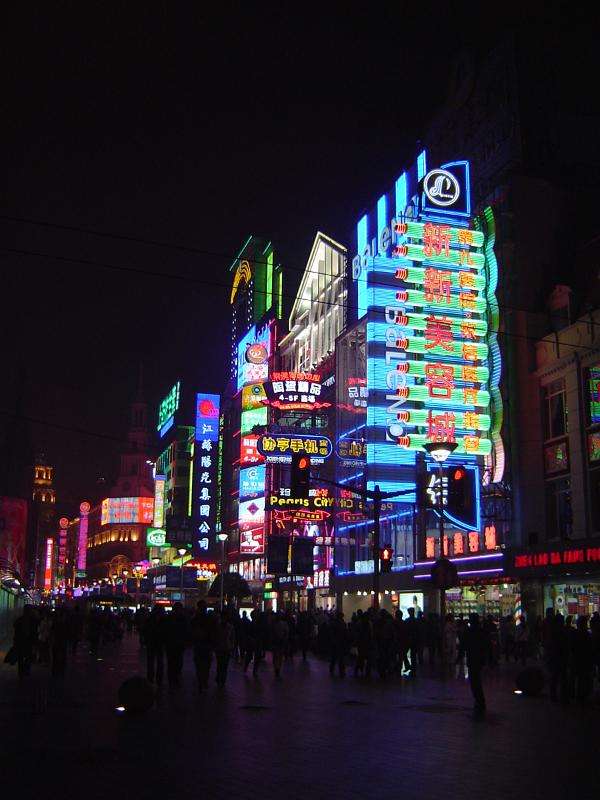Attractive Colorful Neon Lights From Various Commercial Buildings in Chinese City View at Night Time.