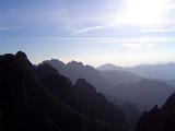 Yellow Mountain, China, vista with the Huangshan mountain range stretching away into the distance on a hazy sunny day