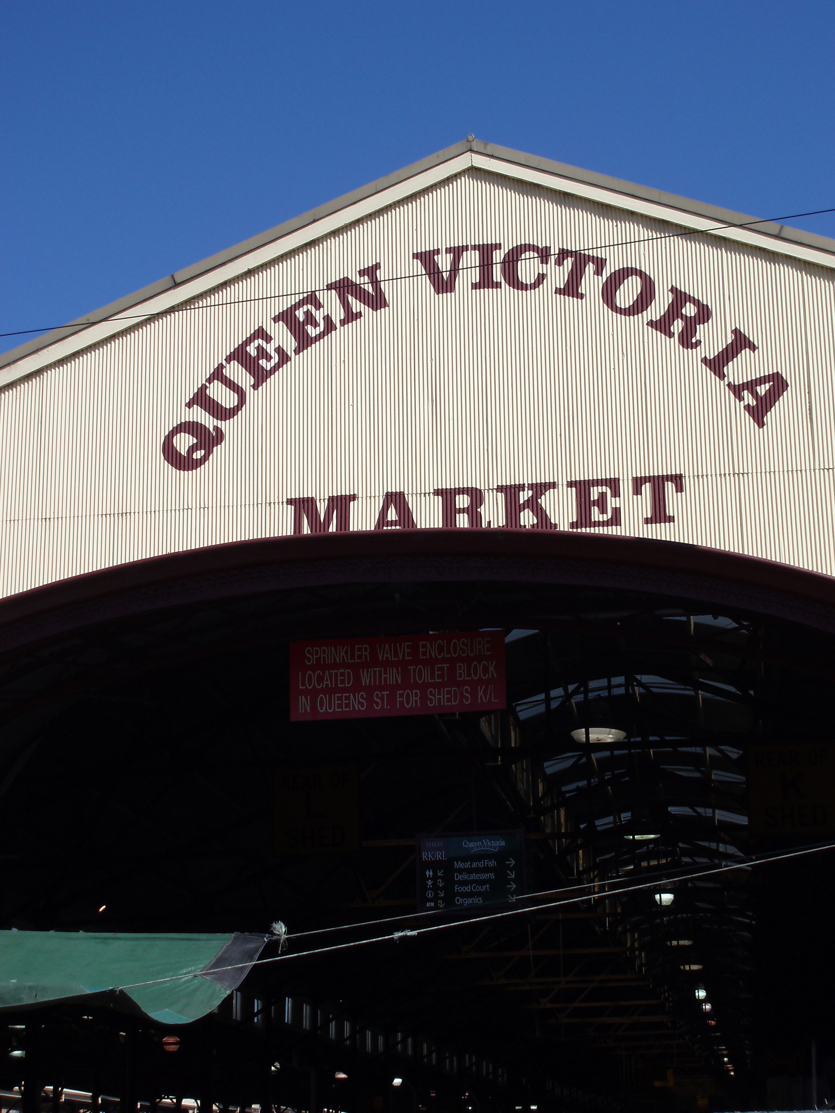 an image of Signage of Famous Queen Victoria Market in Melbourne on Blue Sky Background.