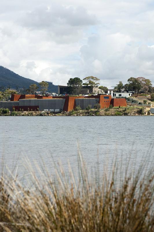 A portrait orientated shot of the Mona art museum and surrounding river in Hobart, Australia.