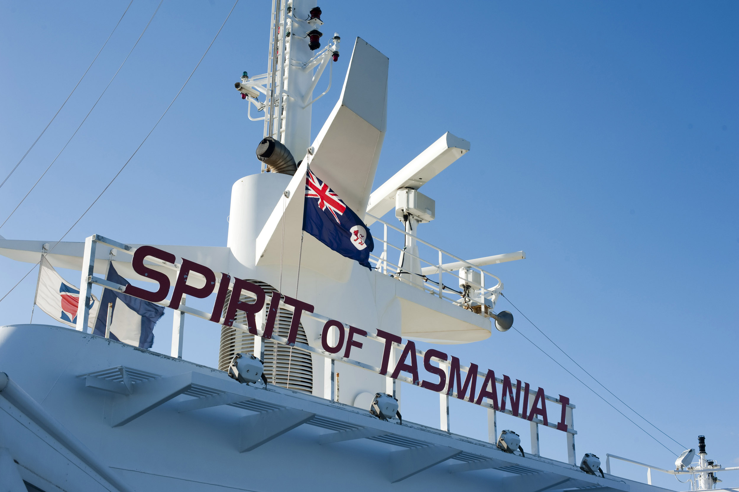 an image of A close up of the Australian flag, radar and sonar equipment on the Spirit of Tasmania ferry in Australia.