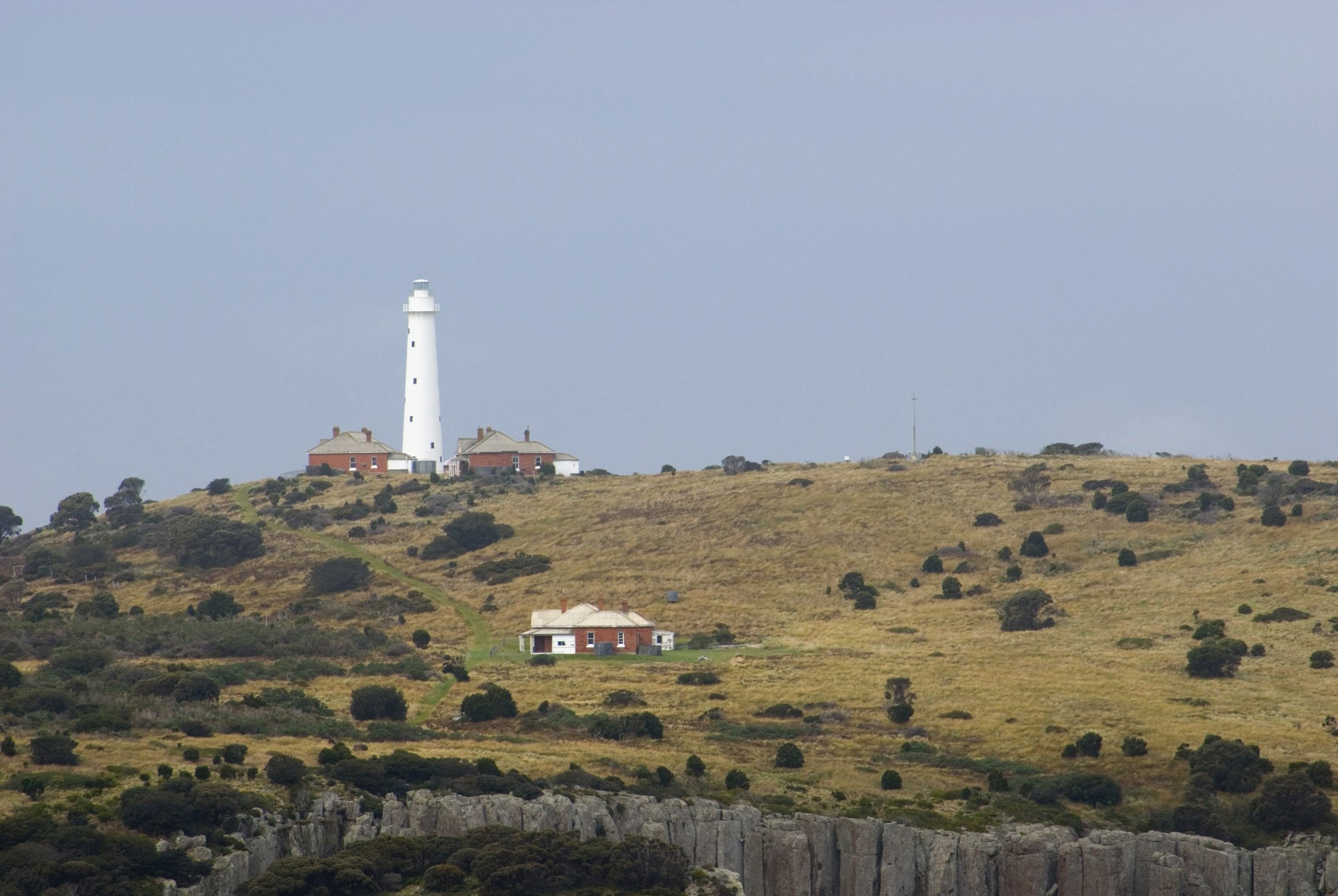 an image of lighthouse on top of tasman island, tasman peninsula, tasmanaia, australia