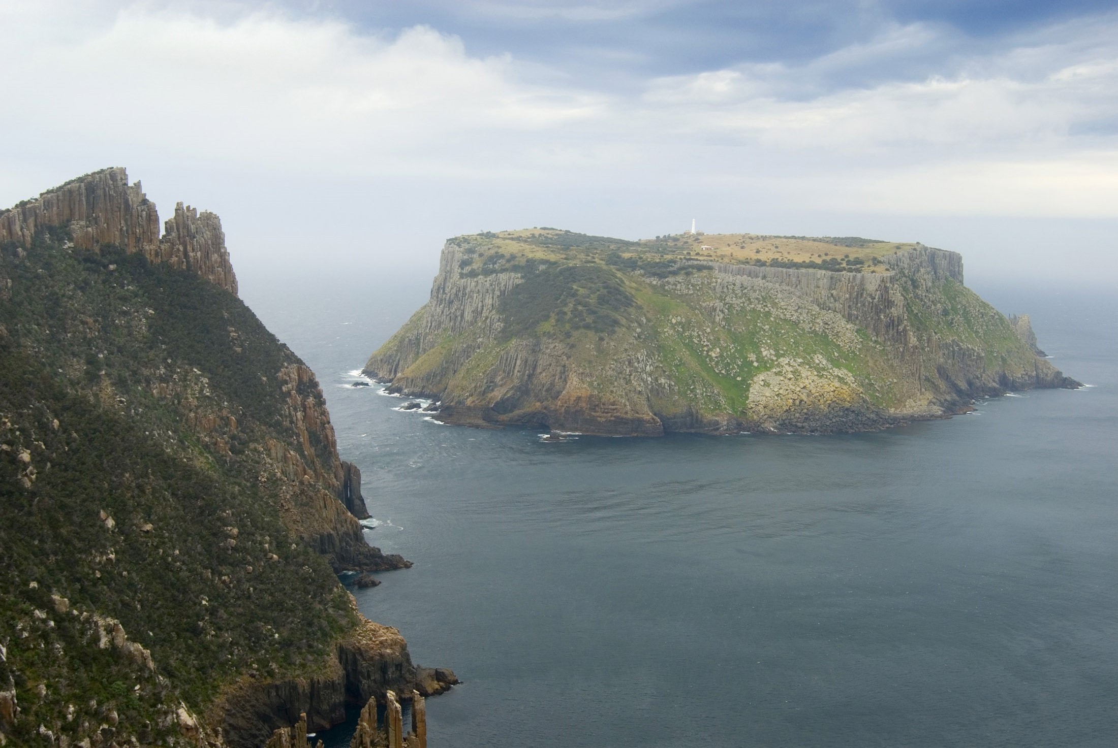 an image of tasman island and jagged dolertite cliffs of cape pillar, tasman peninusla