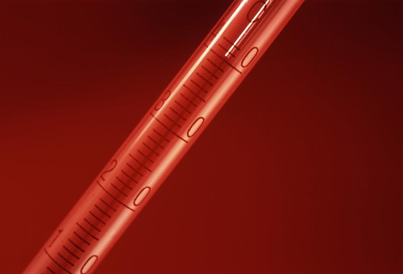 Close Up of Red Hot Thermomter on Red Background Close Up of Red Hot Thermomter on Red Background, Studio Shot