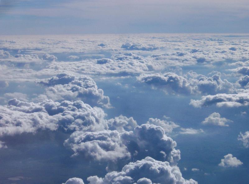 Overview of Puffy Clouds in Blue Sky Overview of Puffy Clouds in Blue Sky as if Shot from Airplane