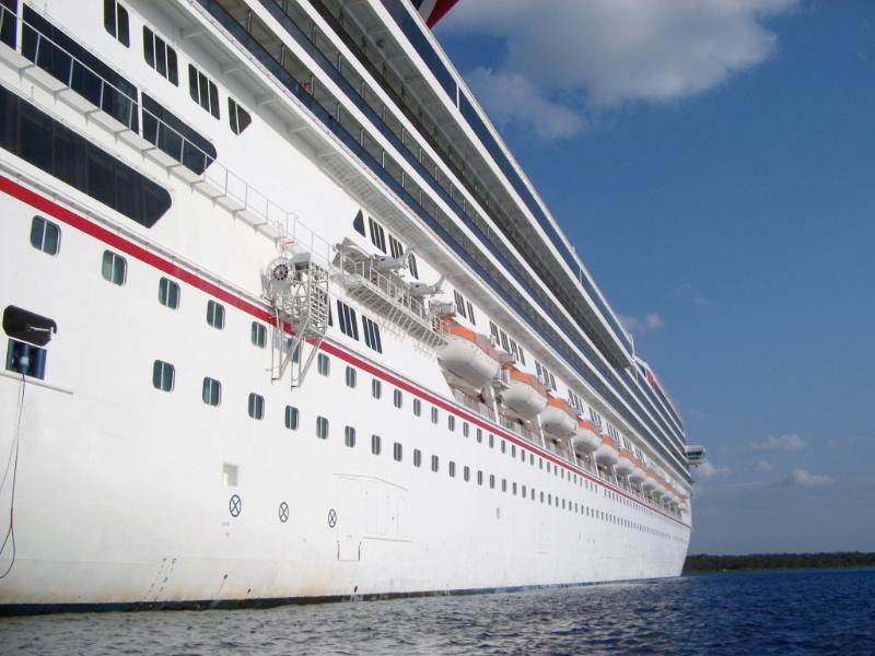 Water Level View of Cruise Ship Against Blue Sky