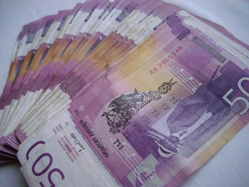Background of Yugoslav banknotes Background of Yugoslav banknotes fanned out in a receding line away from the camera