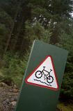 Cycle track sign on a marker showing uneven terrain marking the route of a recreational cycling track
