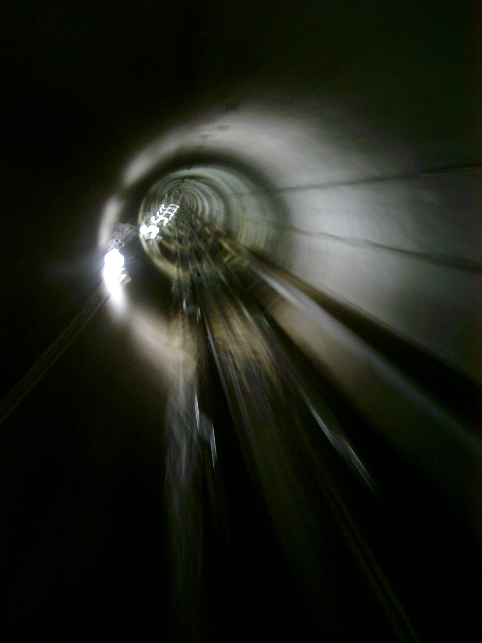 an image of Motion background of a rail tunnel disappearing into the distance as a train travels through at speed in a travel, transport and commuting concept