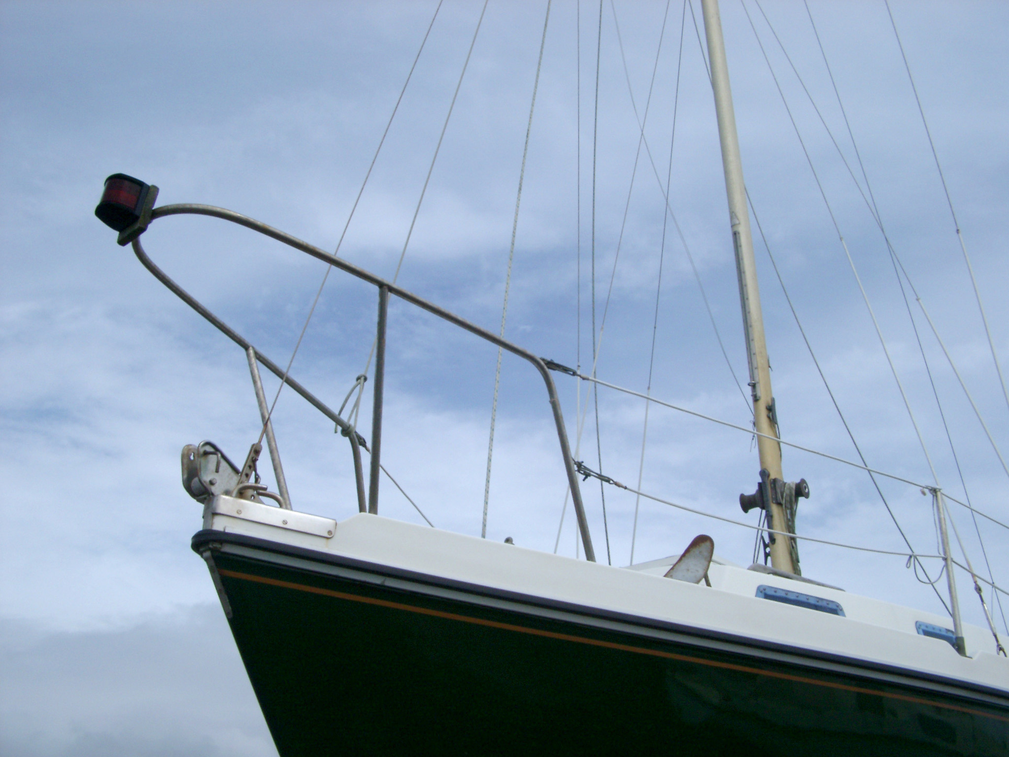 an image of Low Angle View of Forecastle Bow of Yacht Against Cloudy Sky