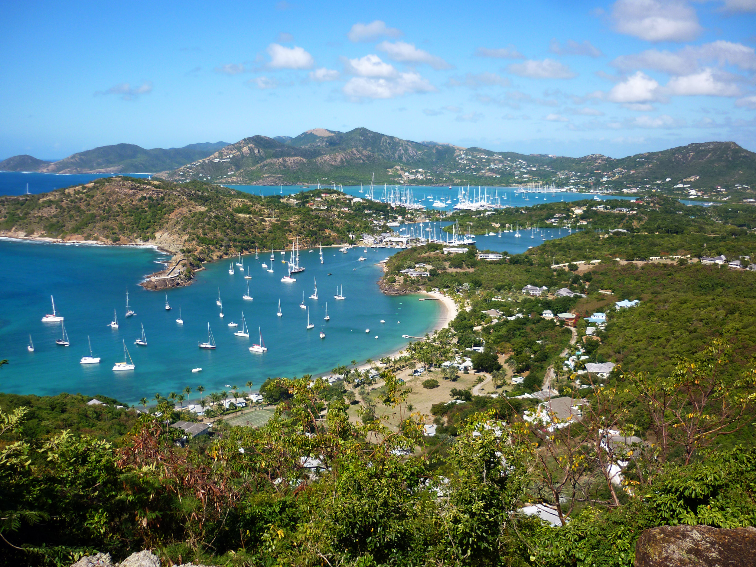 an image of panoramic view of antigua taking in nelsons dockyard, english harbour and surrounding bays from shirley heights