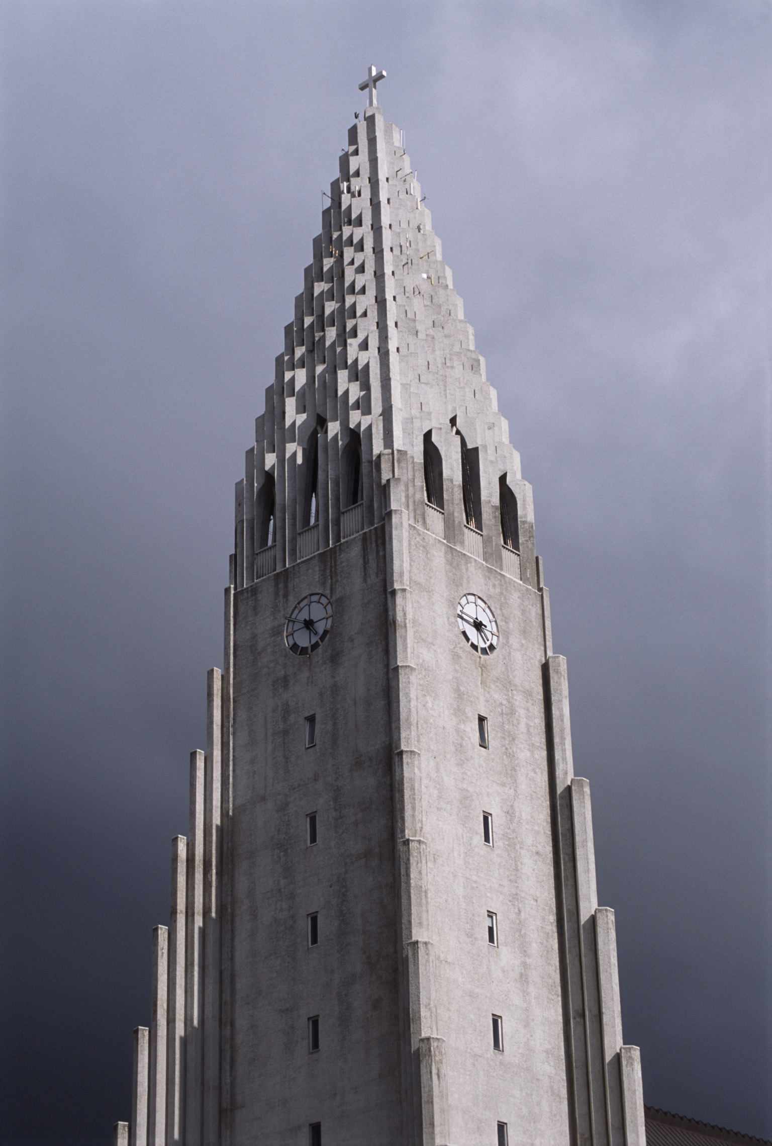 an image of Steeple of Hallgrim Lutheran Cathedral, with unusual impressive architecture, in Reykjavik, Iceland