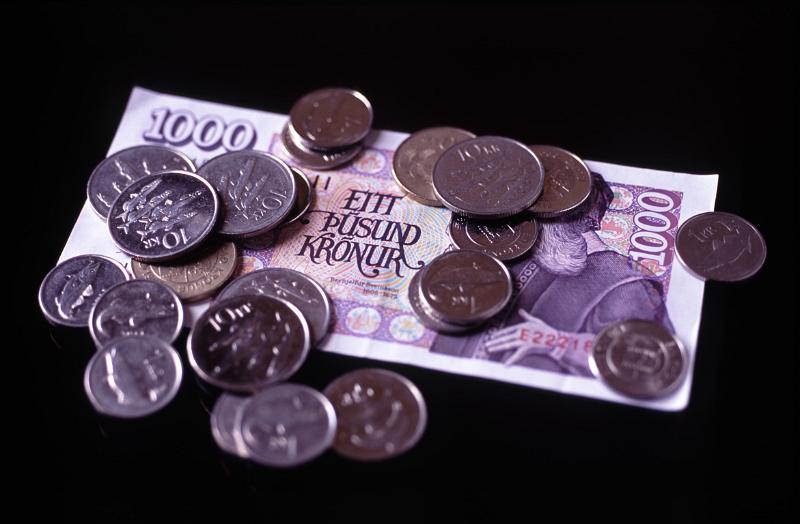 Iceland Krona Currency Bill and Coins on Black Background