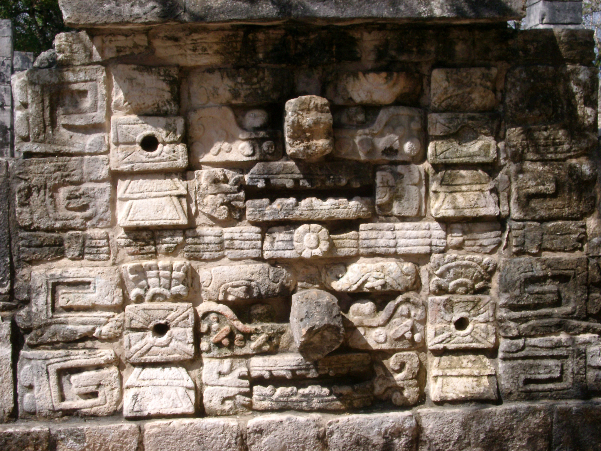 an image of Stone carvings on a ruined building in the Archoeological important Mayan ruins of Chitzen Itza on the Yucatan Peninsula, Mexico