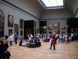 Crowds of visitors and tourists inside the Louvre Museum, Paris