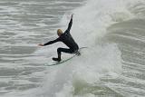 Surfer in Perfect Balancing Position of the californian coast