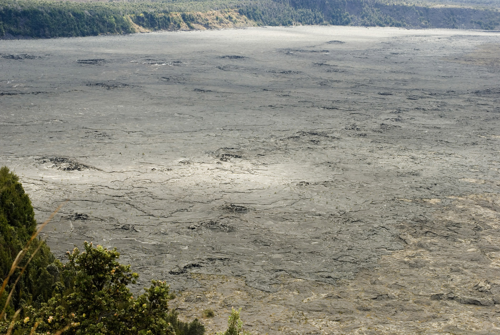 an image of View overlooking the lava pool at Kilauea Iki Crater, a pit crater alongside the Kilauea Caldera in the Hawaii Volcanoes National Park