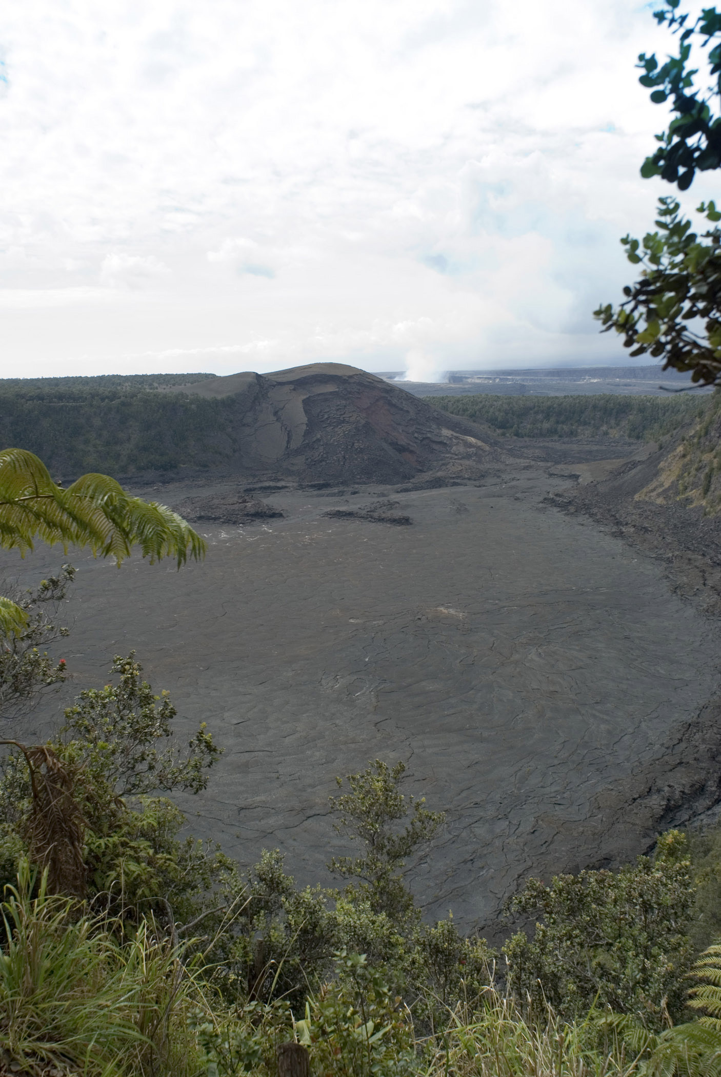 an image of Overview of Kilauea Iki Crater in Hawaii with Cloudy Sky