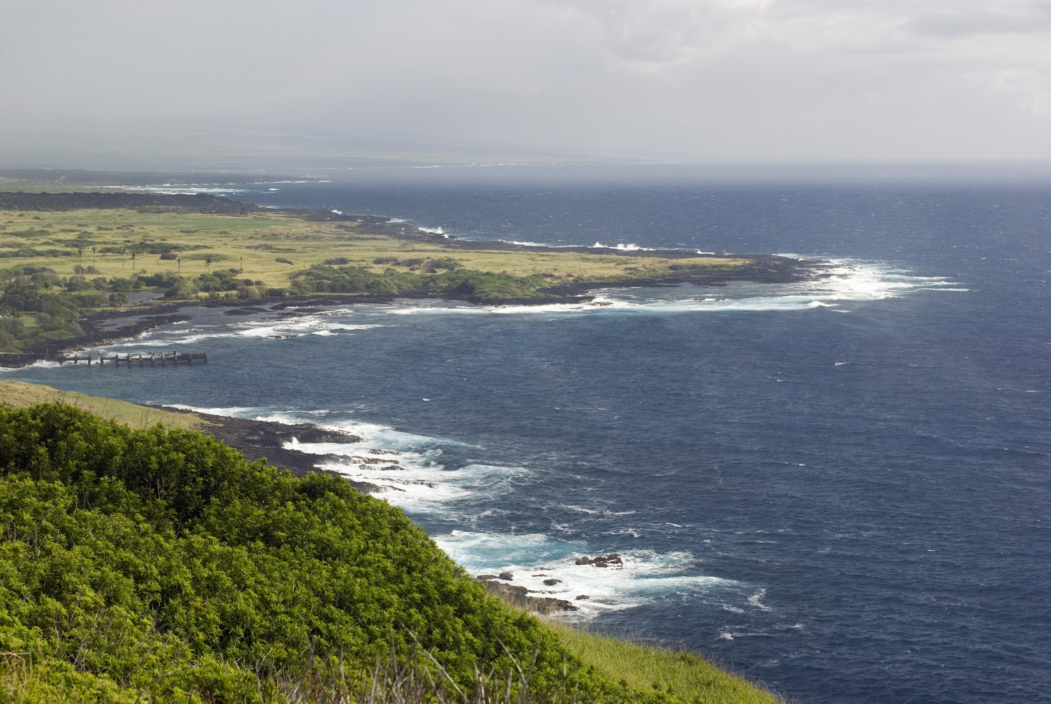 an image of Scenic view along the lush green Big Island coastline, Hawaii, USA, a popular tourist destination
