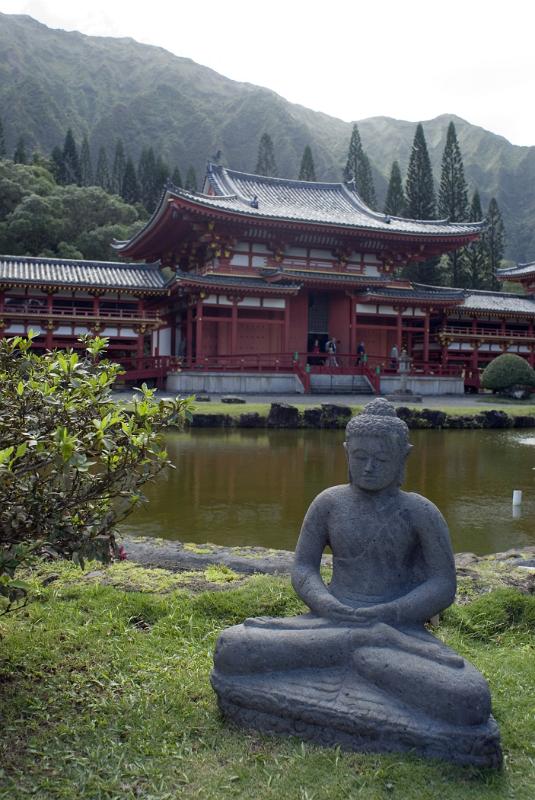 Vintage Sculpture at the Garden Water Side of Famous Byodo-In Buddhist Temple in Hawaii.