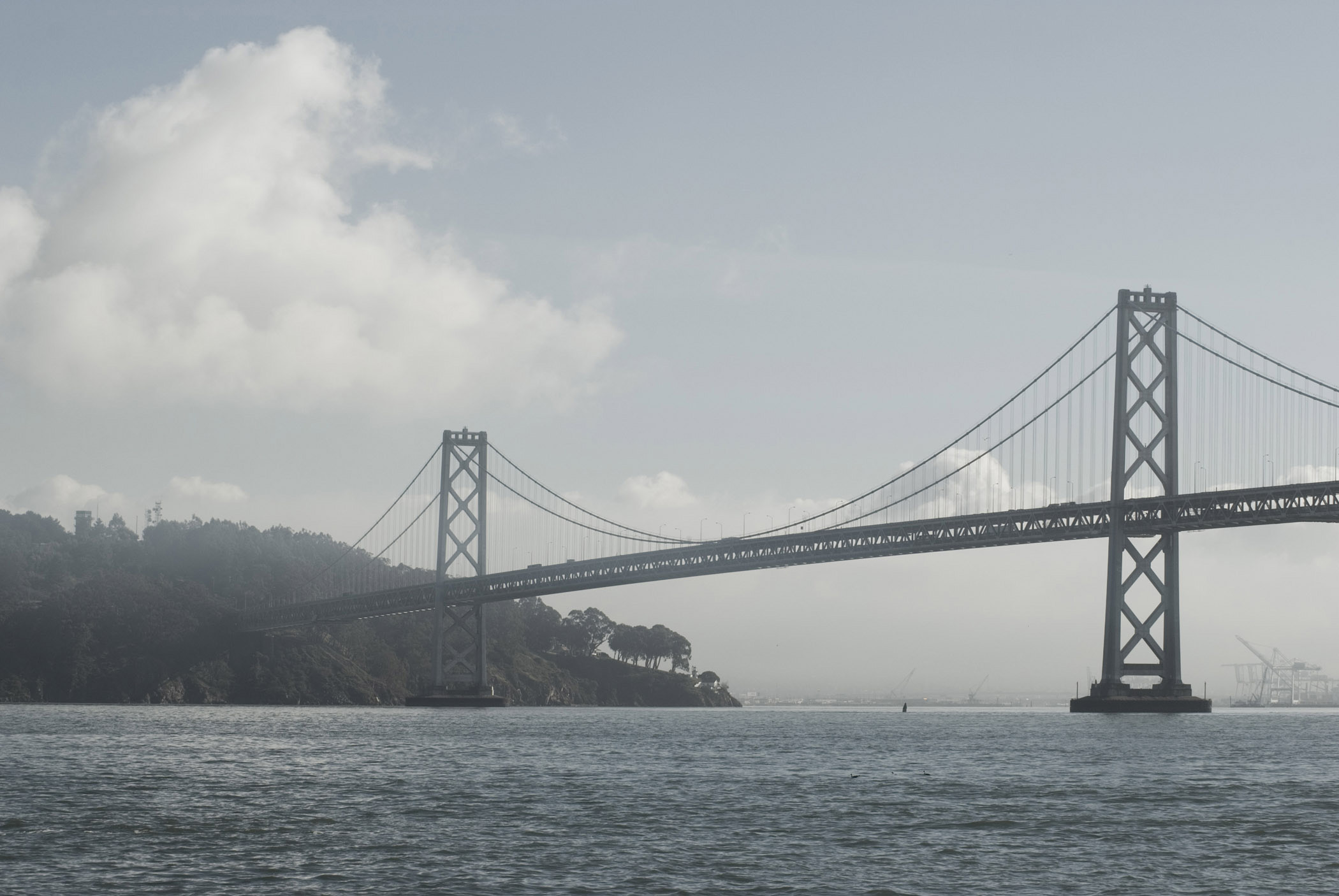 an image of Famous Landmark Bay Bridge in San Francisco with cloudy sky