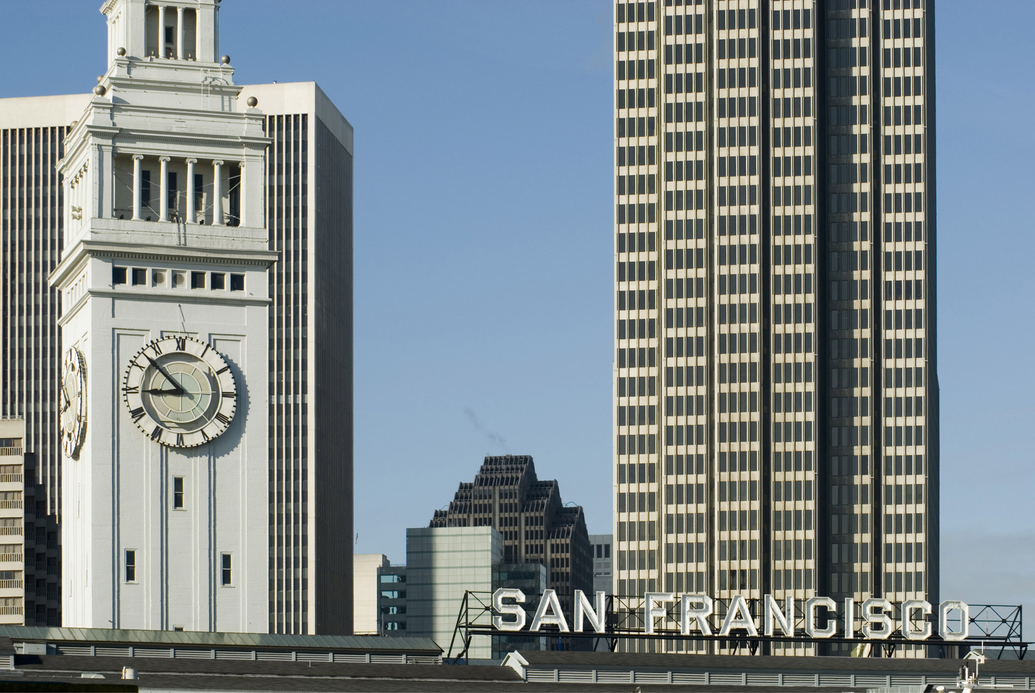 an image of High Rise Architectural Embarcadero Buildings in San Francisco. Isolated on Lighter Gradient Blue Sky Background