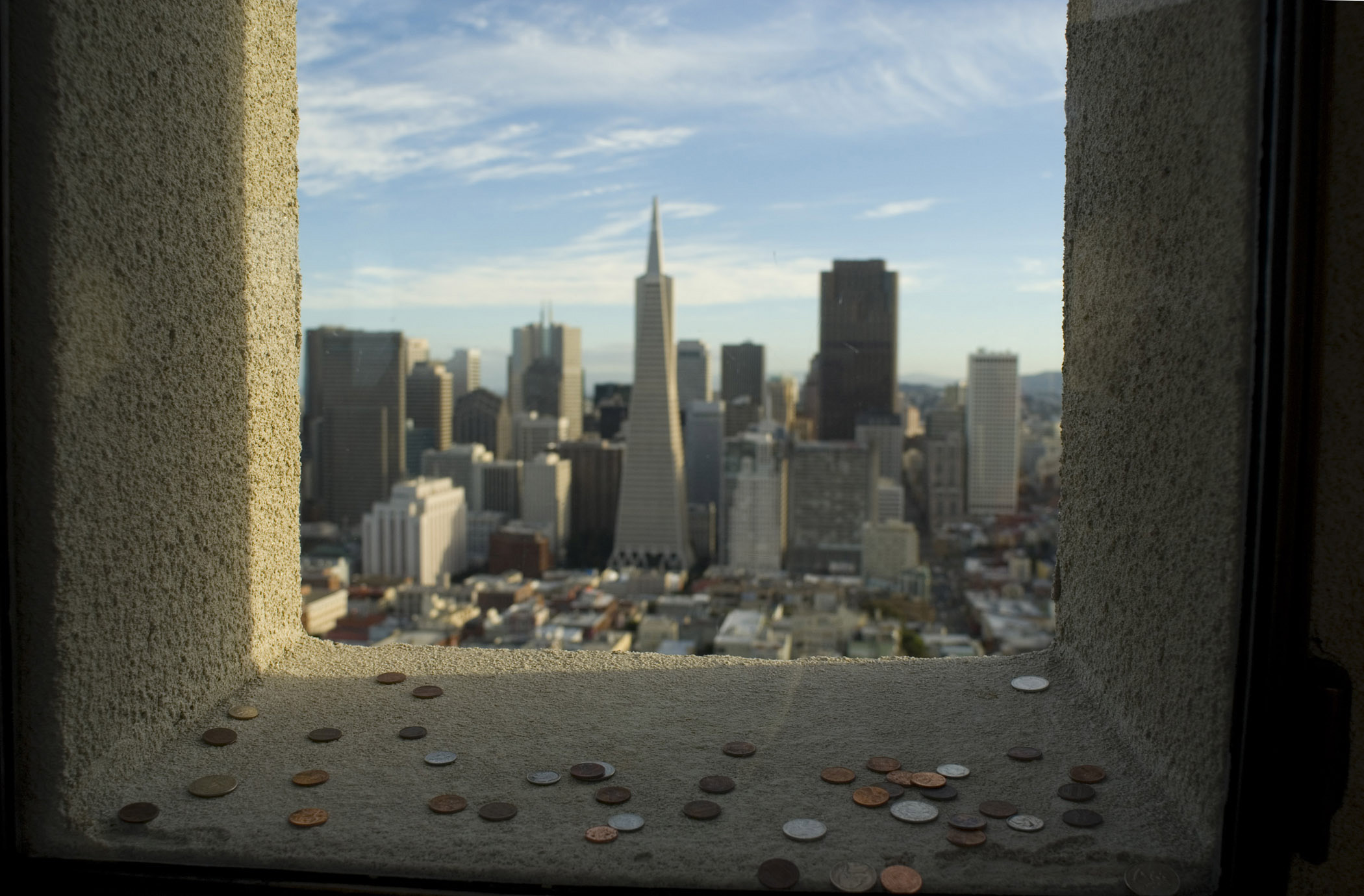 an image of Coit Tower Coins thrown for good luck through the window overlooking the central CBD of San Francisco