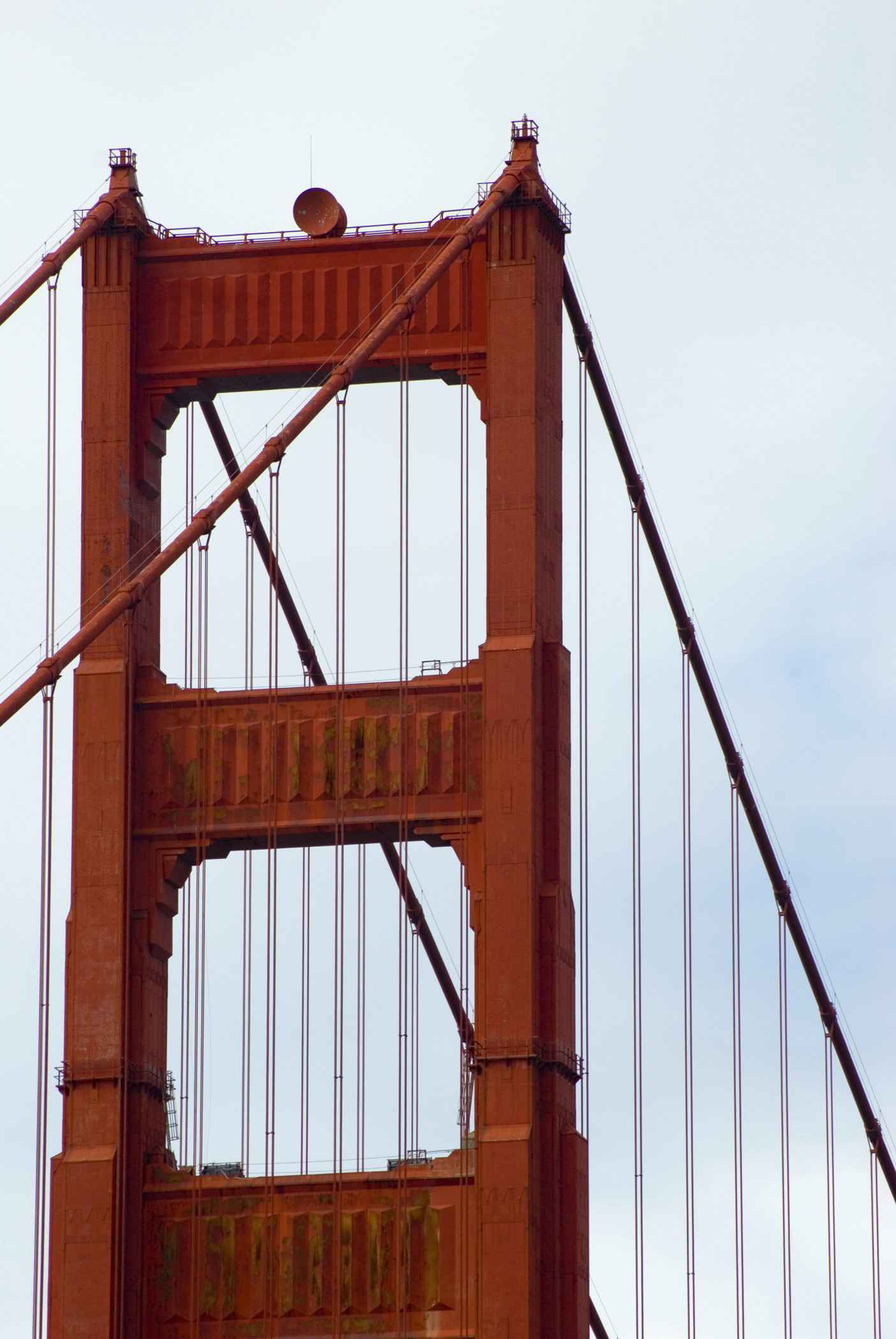an image of Famous Tower and Cables at Golden Gate Bridge San Francisco on Light Blue Sky Background.