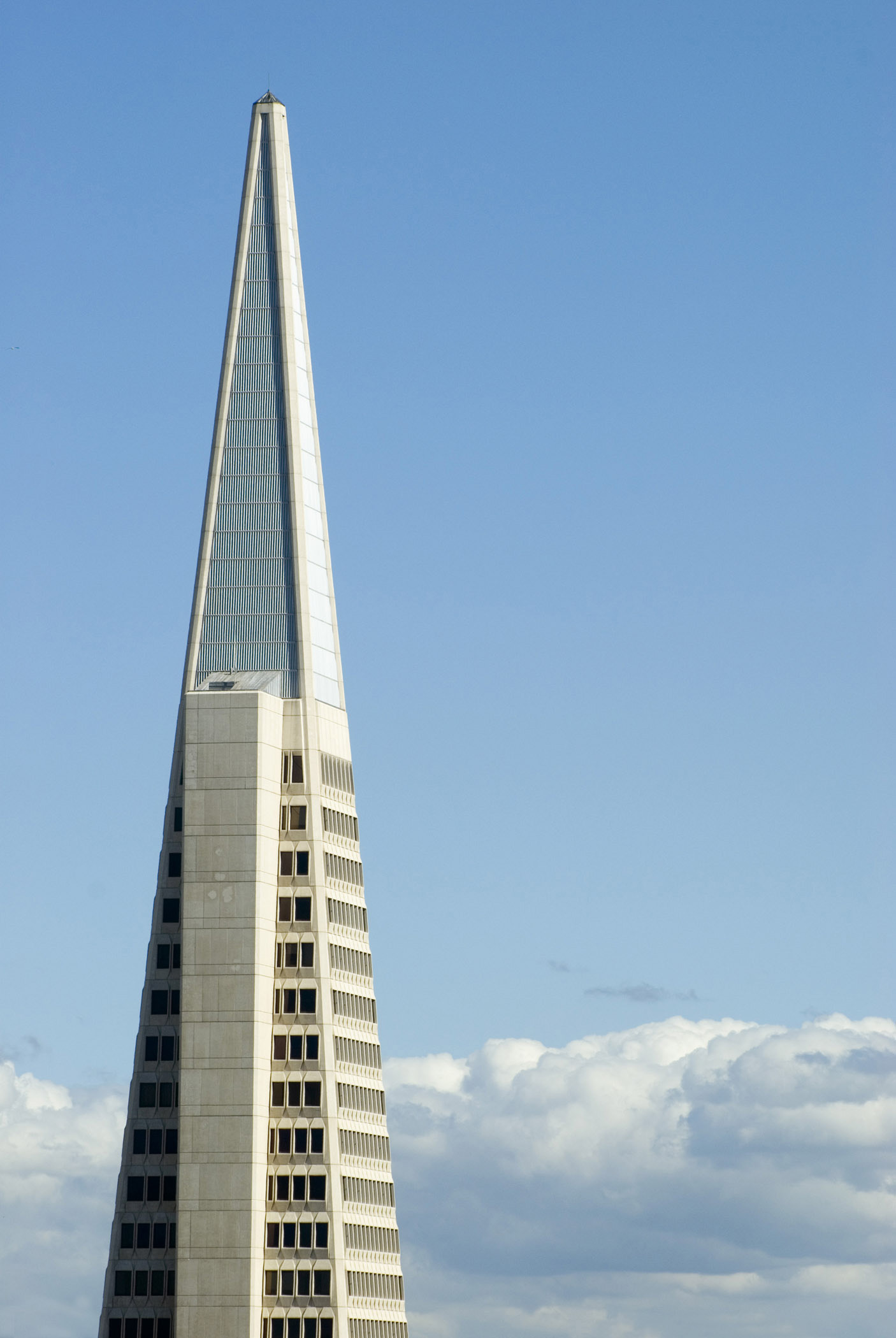 an image of Exterior view of the facade of the Transamerica Pyramid building, San Francisco , California, USA against a sunny blue sky