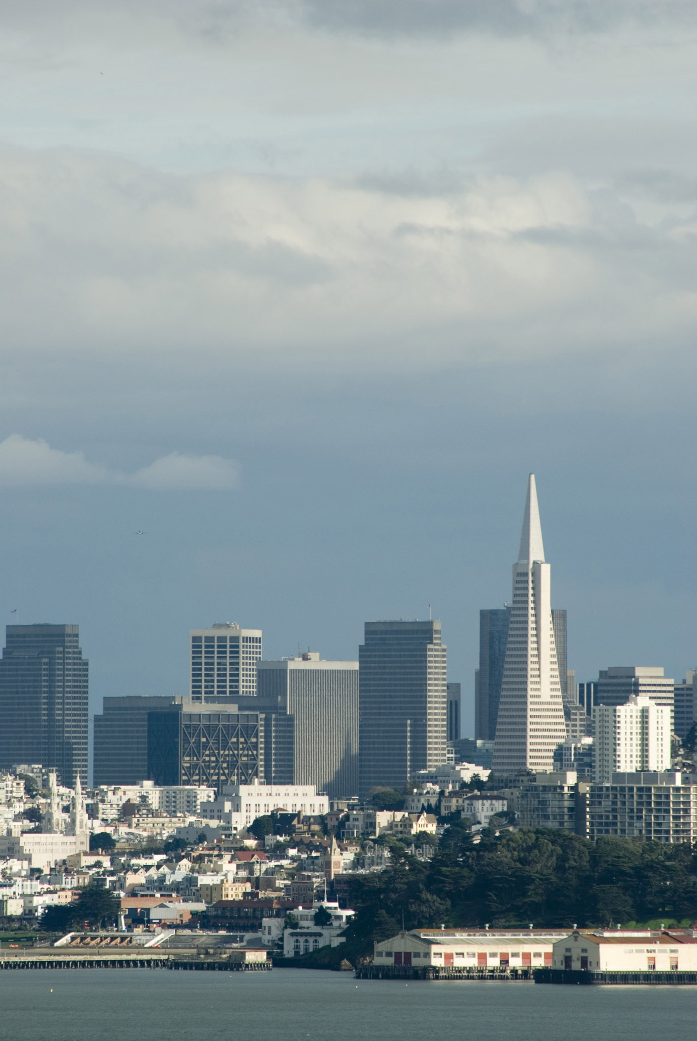 an image of Plenty Tall Building Structures at Skyline San Francisco. Isolated on Light Blue Gray Sky Background.