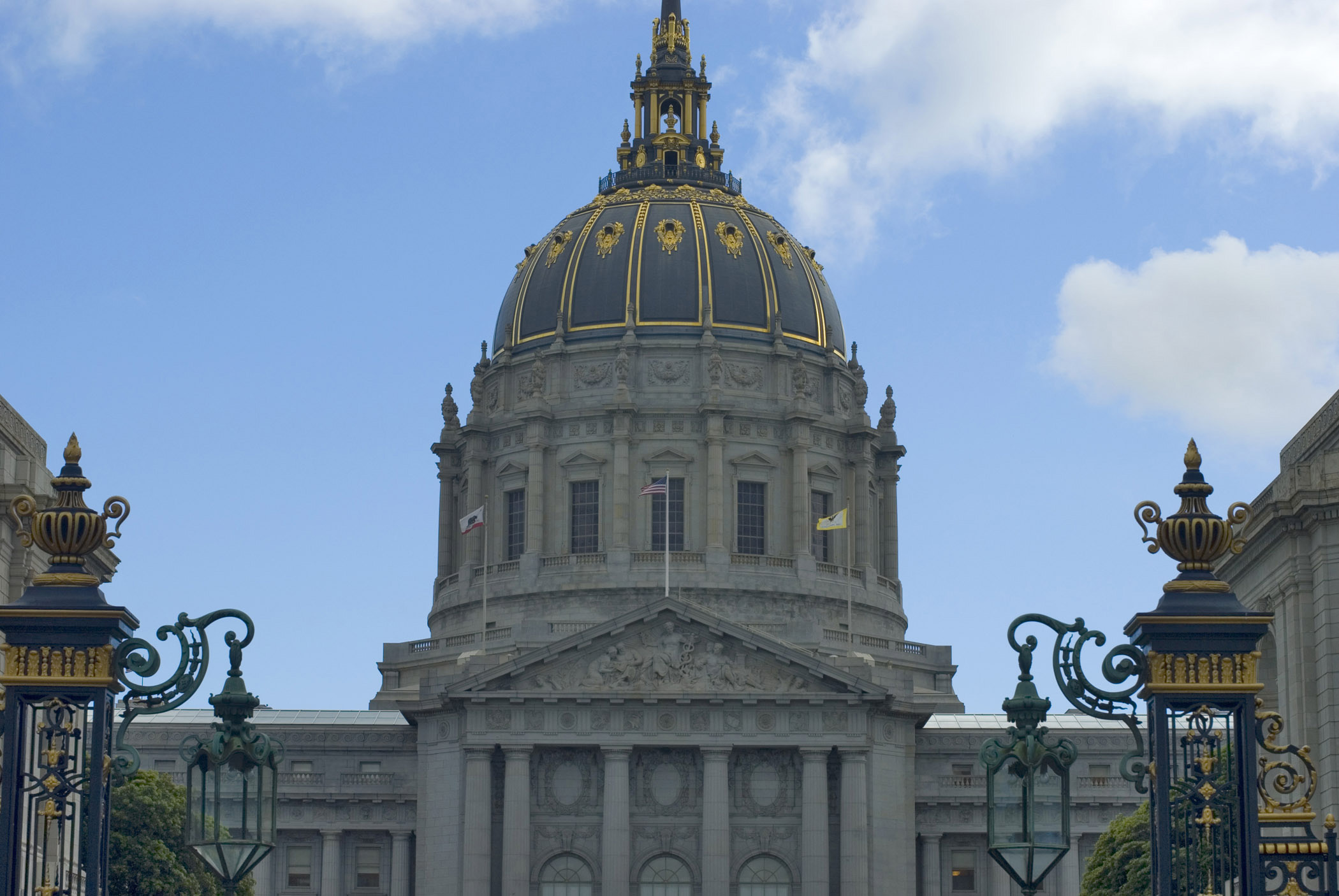an image of Old Vintage Architectural San Francisco City Hall Dome Isolated on Light Blue Sky Background.