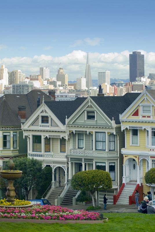 View of the Painted Ladies, a row of iconic landmark historical townhouses in Alamo Square, San Francisco, California, USA