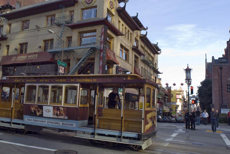 Vintage Vehicle Passing on Street of Chinatown in San Francisco. Isolated on Old Buildings. Captured in the day Time.
