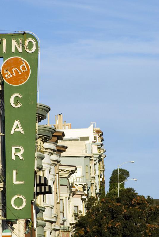 Vintage Architectural Building at North Beach Telegraph Hill on Light Blue Sky Background.