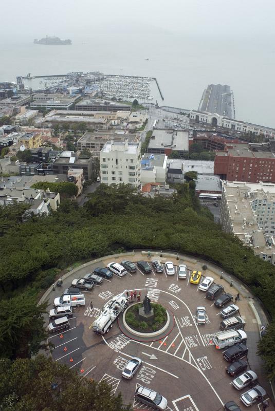 Cars at Pioneer Park Turnaround Surrounded by Green Grasses and Buildings in Aerial View