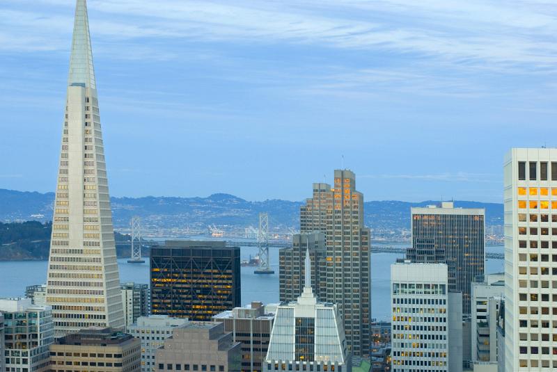 San Francisco city skyline with the modern architecture and pyramidal skyscrapers overlooking the Bay and Bridge