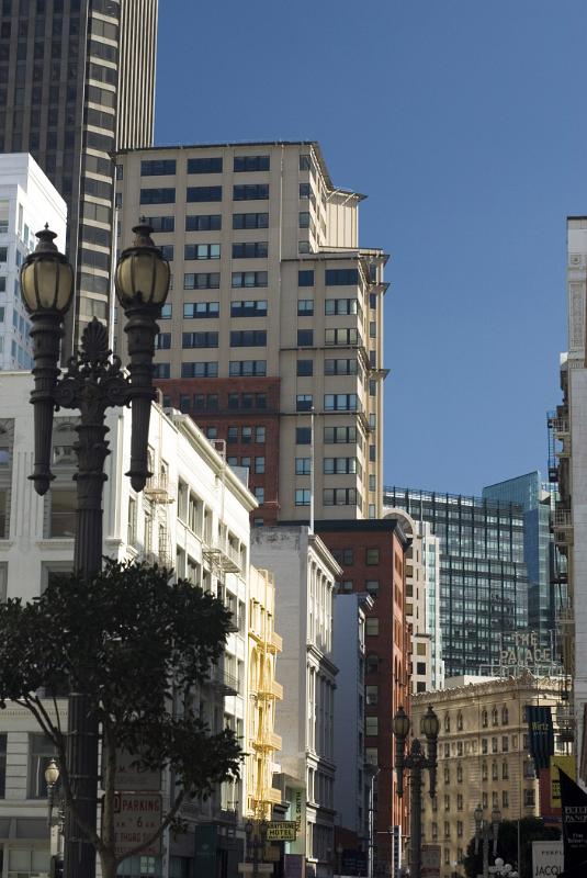 Various Architectural High City Buildings in San Francisco. Isolated on Blue Gray Sky Background.