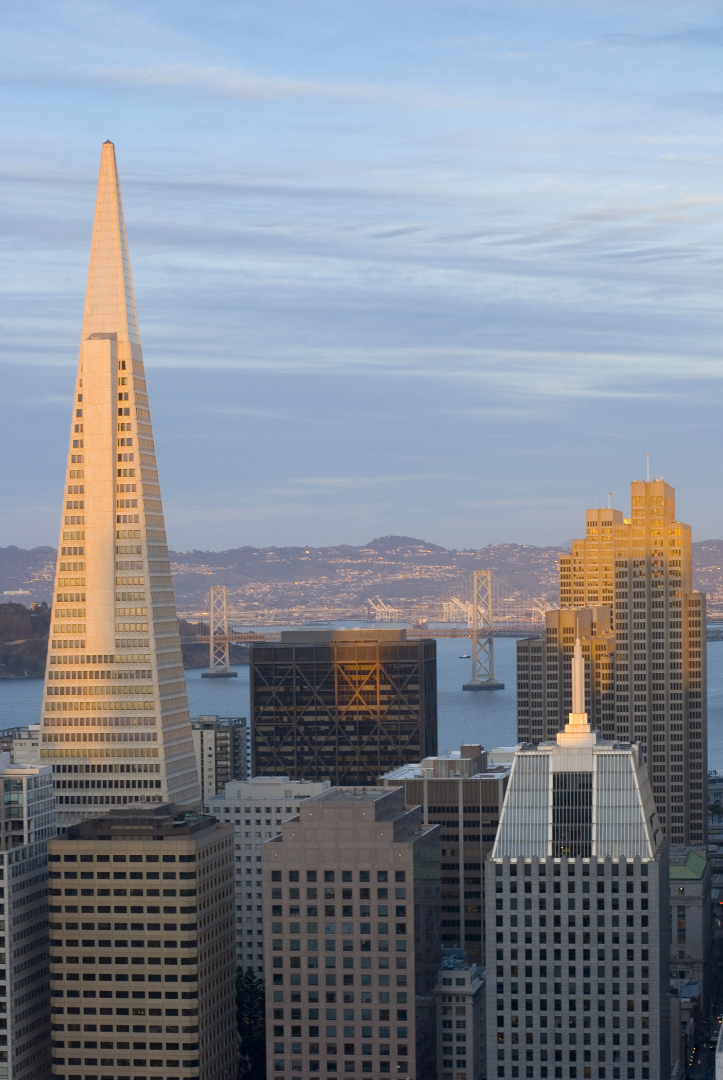 an image of Sunset cityscape, San Francisco, California, USA illuminating the landmark Transamerica Pyramid building in glowing light
