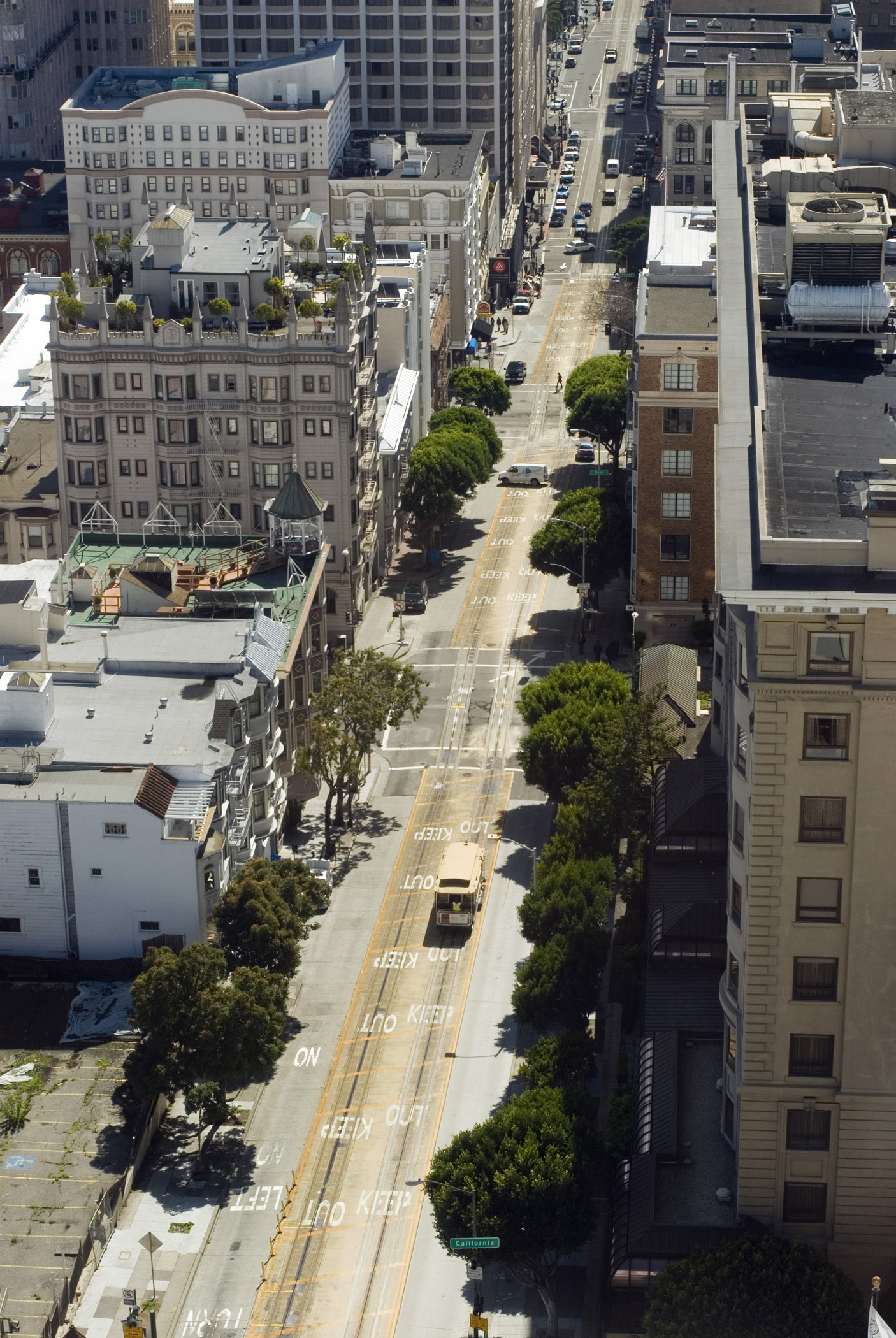 an image of Various Building Structures Along San Francisco City Street in Aerial View.