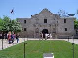 Famous The Alamo Complex Structure in Front View with Random Tourists. Captured on Light Blue Sky Background. Located at San Antonio Texas.