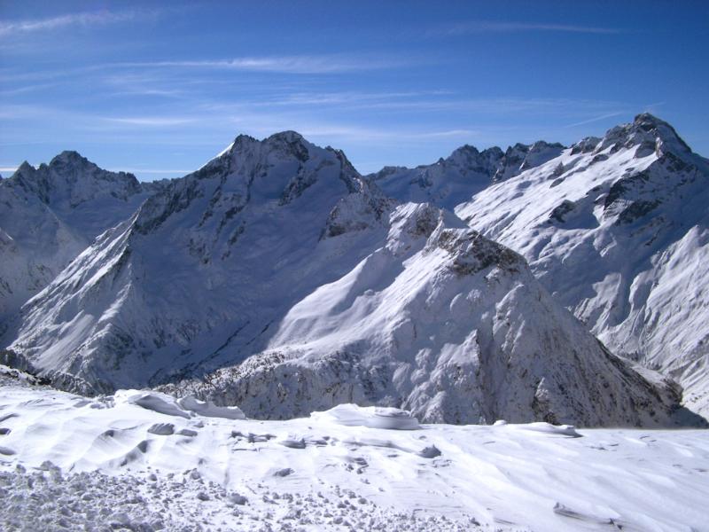 Attractive View of Snow Filled Mountains on Winter Holiday Season with Light Blue Sky Background.